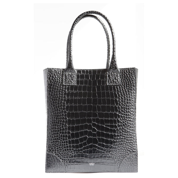 Black Croc-embossed leather shopper handbag. Long handles to wear over the shoulder. A vertical tote bag to wear and carry your essentials to work.