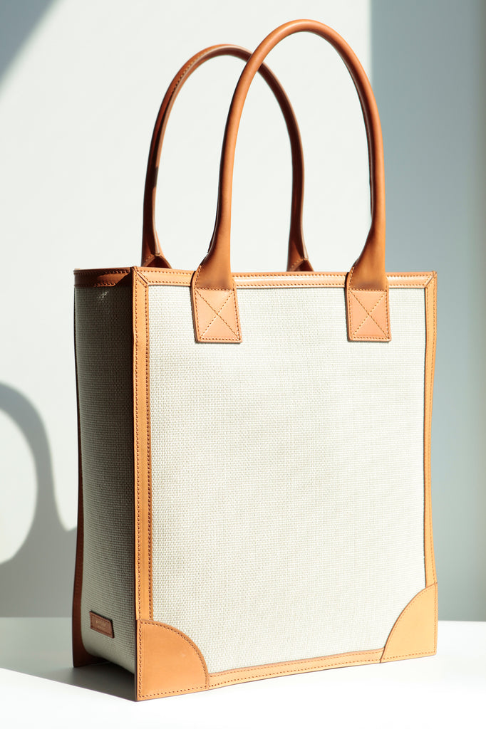 Side view of the Duke Shopper Tote Bag, showing the with of the gusset and elegant design of the corners.  Logo label is discreetly placed on the side.